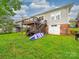 Multi level back decks overlooking lush green lawn and backyard with easy garage access at 705 N Fulton St, Salisbury, NC 28144