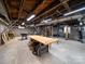Unfinished basement with workbench, exposed beams and ductwork is ready for customization at 705 N Fulton St, Salisbury, NC 28144