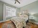 Bedroom with green walls, hardwood floors, a ceiling fan, and two windows at 705 N Fulton St, Salisbury, NC 28144