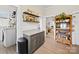 Functional butler's pantry with granite counters, dark cabinets, open shelving, and doorway views to the living area at 705 N Fulton St, Salisbury, NC 28144