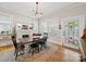 Bright dining room featuring a fireplace, hardwood floors, a dining table and decorative lighting at 705 N Fulton St, Salisbury, NC 28144