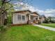 Charming craftsman-style home featuring a welcoming front porch and lush green lawn at 705 N Fulton St, Salisbury, NC 28144
