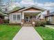 Charming bungalow with inviting front porch, well-maintained lawn, and classic architectural details at 705 N Fulton St, Salisbury, NC 28144