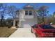 Charming two-story home featuring a two-car garage and modern architectural details at 719 N Kelly St, Statesville, NC 28677