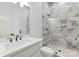 Stylish bathroom featuring modern fixtures, a walk-in shower, and sleek vanity with countertop sink at 8058 Edgewater Dr, Norwood, NC 28128
