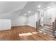 Light-filled bonus room featuring hardwood floors, recessed lighting, and stair access at 8058 Edgewater Dr, Norwood, NC 28128