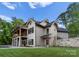 Beautiful craftsman home with an outdoor deck and stone foundation at 8058 Edgewater Dr, Norwood, NC 28128