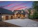 Charming home with a spacious driveway, craftsman accents, and a modern two-car garage at 8058 Edgewater Dr, Norwood, NC 28128