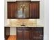 Features custom cabinetry, granite countertop, and a sink, perfect for entertaining guests at 825 Hudson Pl, Davidson, NC 28036