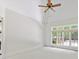 Bright bedroom with a large window overlooking the backyard and plush neutral carpet at 825 Hudson Pl, Davidson, NC 28036