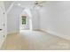 Bright bedroom with pitched ceiling, neutral carpet, and a window providing natural light at 825 Hudson Pl, Davidson, NC 28036