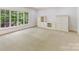 Bonus room featuring built-in cabinets, natural light and neutral walls and flooring at 825 Hudson Pl, Davidson, NC 28036
