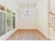Bright dining room with large windows and hardwood floors providing ample natural light at 825 Hudson Pl, Davidson, NC 28036
