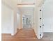 Bright foyer with gleaming hardwood floors and elegant white trim leading to the main living areas at 825 Hudson Pl, Davidson, NC 28036