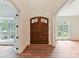 Welcoming foyer featuring beautiful wood floors and views of a cozy living space at 825 Hudson Pl, Davidson, NC 28036