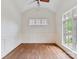 Bright office space with a vaulted ceiling, hardwood floors, and large windows allowing ample natural light at 825 Hudson Pl, Davidson, NC 28036