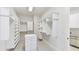 Custom walk-in closet features built in organizers, shelves, drawers, and plush carpet at 825 Hudson Pl, Davidson, NC 28036