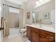 Well-lit bathroom with a vanity, tiled shower-tub, and neutral decor, creating a relaxing atmosphere at 894 Stratford Run Dr, Fort Mill, SC 29708