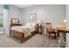 Cozy bedroom featuring carpet, a wooden bed frame, and vintage furniture, creating a warm, inviting space at 894 Stratford Run Dr, Fort Mill, SC 29708