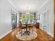 Charming breakfast room with lots of light, features wood floors and views of the backyard at 894 Stratford Run Dr, Fort Mill, SC 29708
