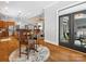 Dining area with hardwood floors and view of kitchen, living room and outdoor patio at 894 Stratford Run Dr, Fort Mill, SC 29708