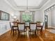 Elegant dining area boasts hardwood floors, sophisticated lighting, and a seamless transition to other living spaces at 894 Stratford Run Dr, Fort Mill, SC 29708