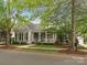 Charming gray home featuring a welcoming front porch and well-maintained landscaping at 894 Stratford Run Dr, Fort Mill, SC 29708