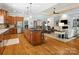Spacious kitchen with wood cabinets, stainless steel appliances, island with seating and a great open floorplan at 894 Stratford Run Dr, Fort Mill, SC 29708