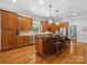 Gourmet kitchen featuring custom wood cabinets, stainless steel appliances, and an island with bar seating at 894 Stratford Run Dr, Fort Mill, SC 29708