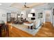 Open-concept living room offers a fireplace, wood floors, and abundant seating for easy entertaining at 894 Stratford Run Dr, Fort Mill, SC 29708