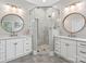 Bathroom with dual vanities, walk-in shower with frameless glass, and tile flooring at 894 Stratford Run Dr, Fort Mill, SC 29708