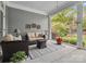 Relaxing screened-in porch with comfortable seating and views of lush backyard at 894 Stratford Run Dr, Fort Mill, SC 29708