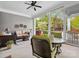 Screened-in patio with outdoor seating and view of manicured backyard at 894 Stratford Run Dr, Fort Mill, SC 29708