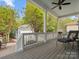 Inviting porch features a lounge chair, ceiling fan, and wood-look decking, perfect for relaxing outdoors at 894 Stratford Run Dr, Fort Mill, SC 29708