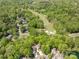 Top-down view of neighborhood featuring golf course and tree coverage, showing a close knit community at 9012 Saint Thomas Ln, Charlotte, NC 28277