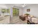 Inviting living room featuring neutral decor, wood-look floors, and ample natural light at 9012 Saint Thomas Ln, Charlotte, NC 28277