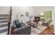 Cozy living room showcases a fireplace, plush seating, and large windows for natural light at 9012 Saint Thomas Ln, Charlotte, NC 28277
