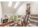 High-angle view showing a living room, dining area, and deck with ample natural light from skylights at 9012 Saint Thomas Ln, Charlotte, NC 28277