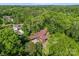 Brick home surrounded by mature trees and lush landscaping at 916 E Park Dr, Lincolnton, NC 28092