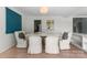 Bright dining room with wooden floor, marble dining table and stylish chairs with decorative cushions at 916 E Park Dr, Lincolnton, NC 28092