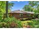 Brick home featuring mature trees, landscaping and a beautiful lawn at 916 E Park Dr, Lincolnton, NC 28092