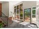 Sunlit foyer with brick accents, large windows, and modern design elements creates a welcoming entrance at 916 E Park Dr, Lincolnton, NC 28092