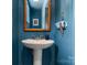 This vintage powder room features a pedestal sink and unique fixtures at 916 E Park Dr, Lincolnton, NC 28092