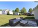 Expansive backyard with outdoor seating and a fenced yard, perfect for entertaining and outdoor activities at 1002 Christobal Ct, Indian Trail, NC 28079