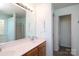 Bathroom featuring double sinks, wood cabinets, and tile floors at 1002 Christobal Ct, Indian Trail, NC 28079