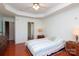 Spacious bedroom with wood floors, modern decor, and a ceiling fan at 1002 Christobal Ct, Indian Trail, NC 28079