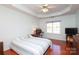 Spacious bedroom with wood floors, modern decor, and a ceiling fan at 1002 Christobal Ct, Indian Trail, NC 28079