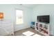 Cozy bedroom with wood-look floors, natural light and modern furniture at 1002 Christobal Ct, Indian Trail, NC 28079