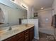 Bathroom featuring double vanity, tub, and tiled floor at 1033 Lilly Pond Dr, Fort Mill, SC 29715