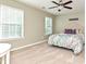 Bright bedroom with carpet, natural light from two windows, and a ceiling fan at 1033 Lilly Pond Dr, Fort Mill, SC 29715